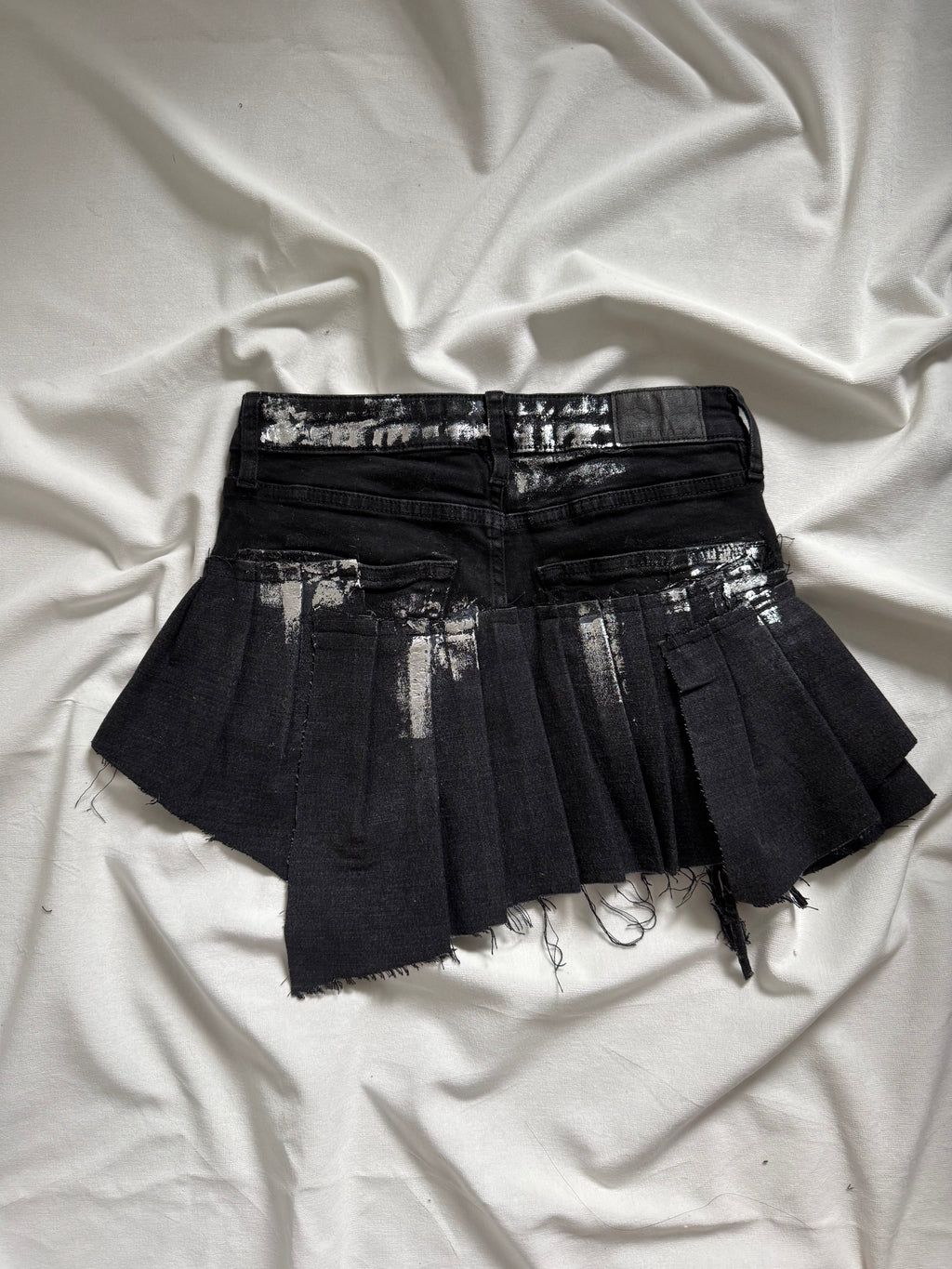 Asymmetrical silver foil pleated mini skirt
