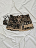 Asymmetrical camo print pleated mini skirt