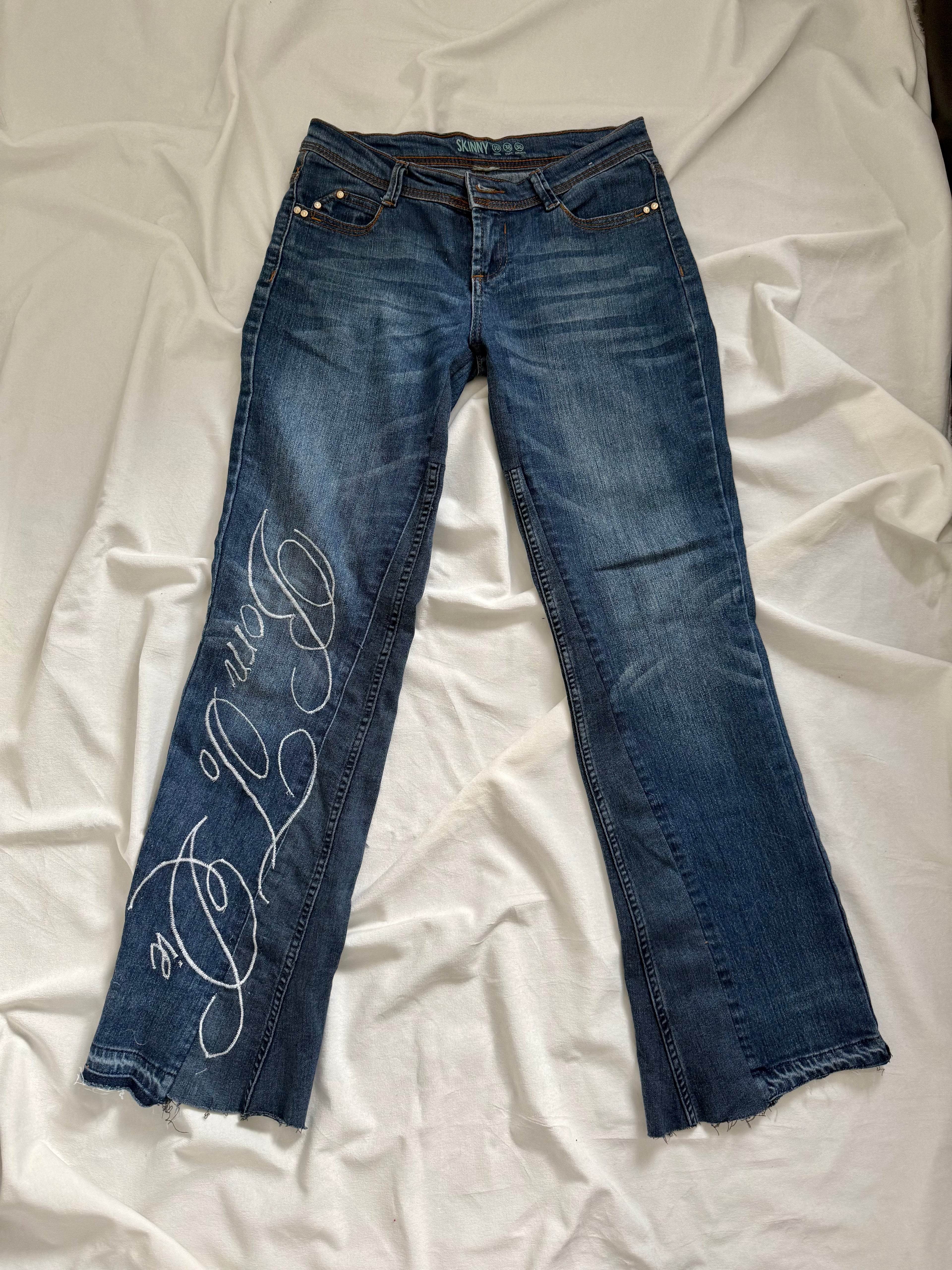 blue denim distressed bootcut jeans