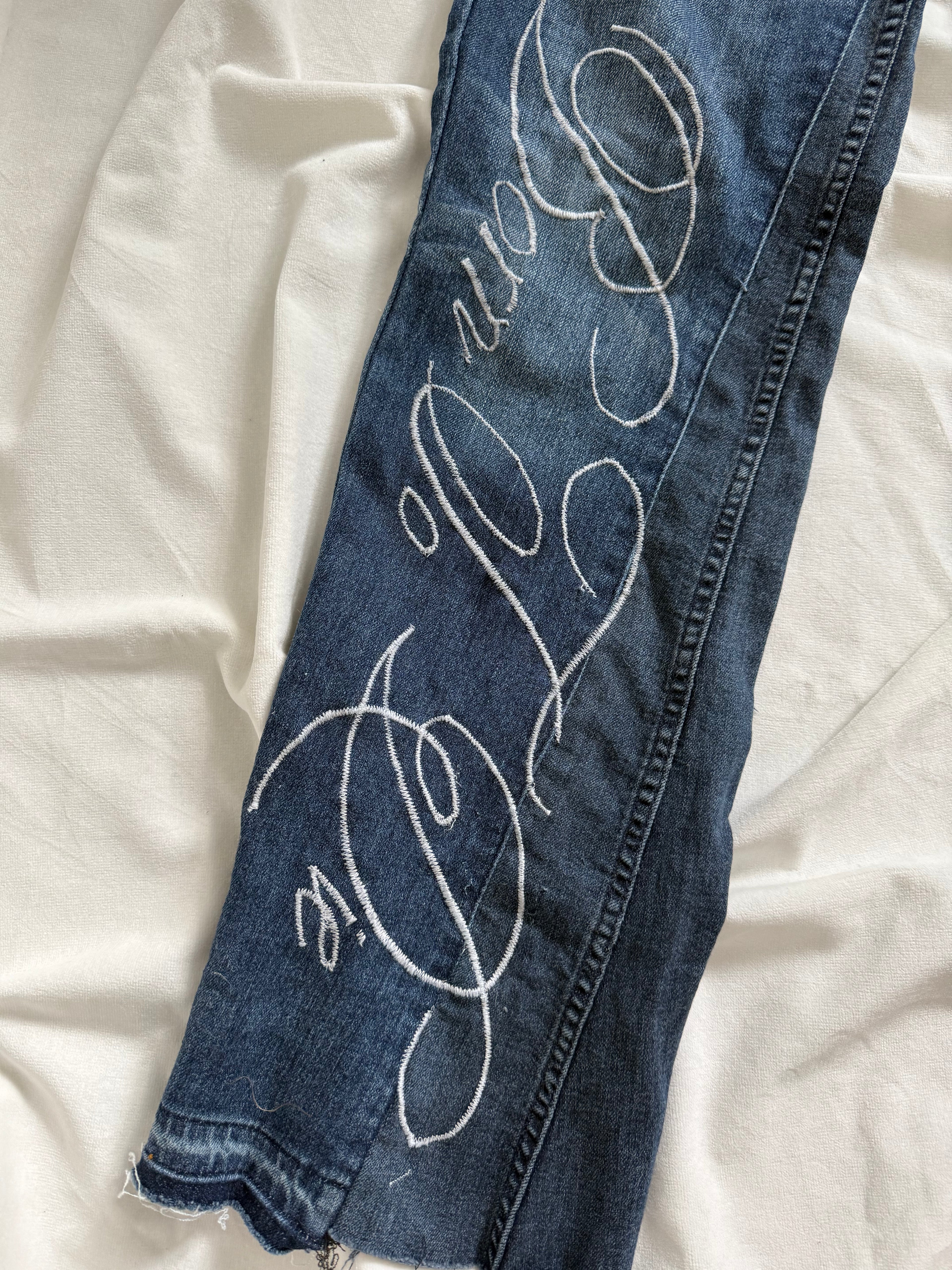 blue denim distressed bootcut jeans
