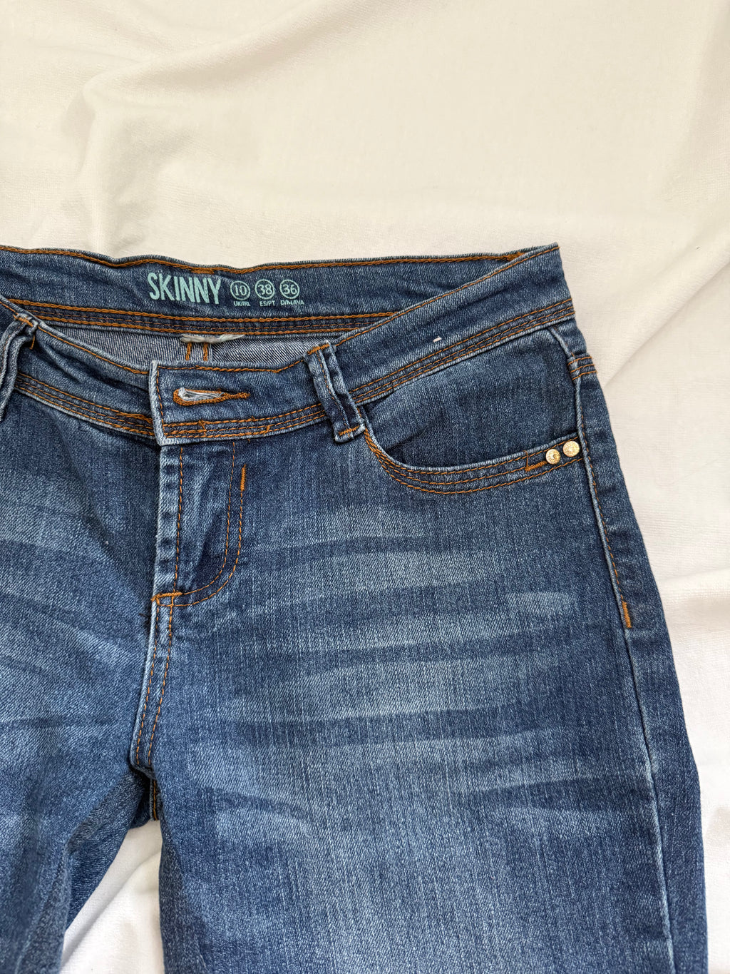 blue denim distressed bootcut jeans
