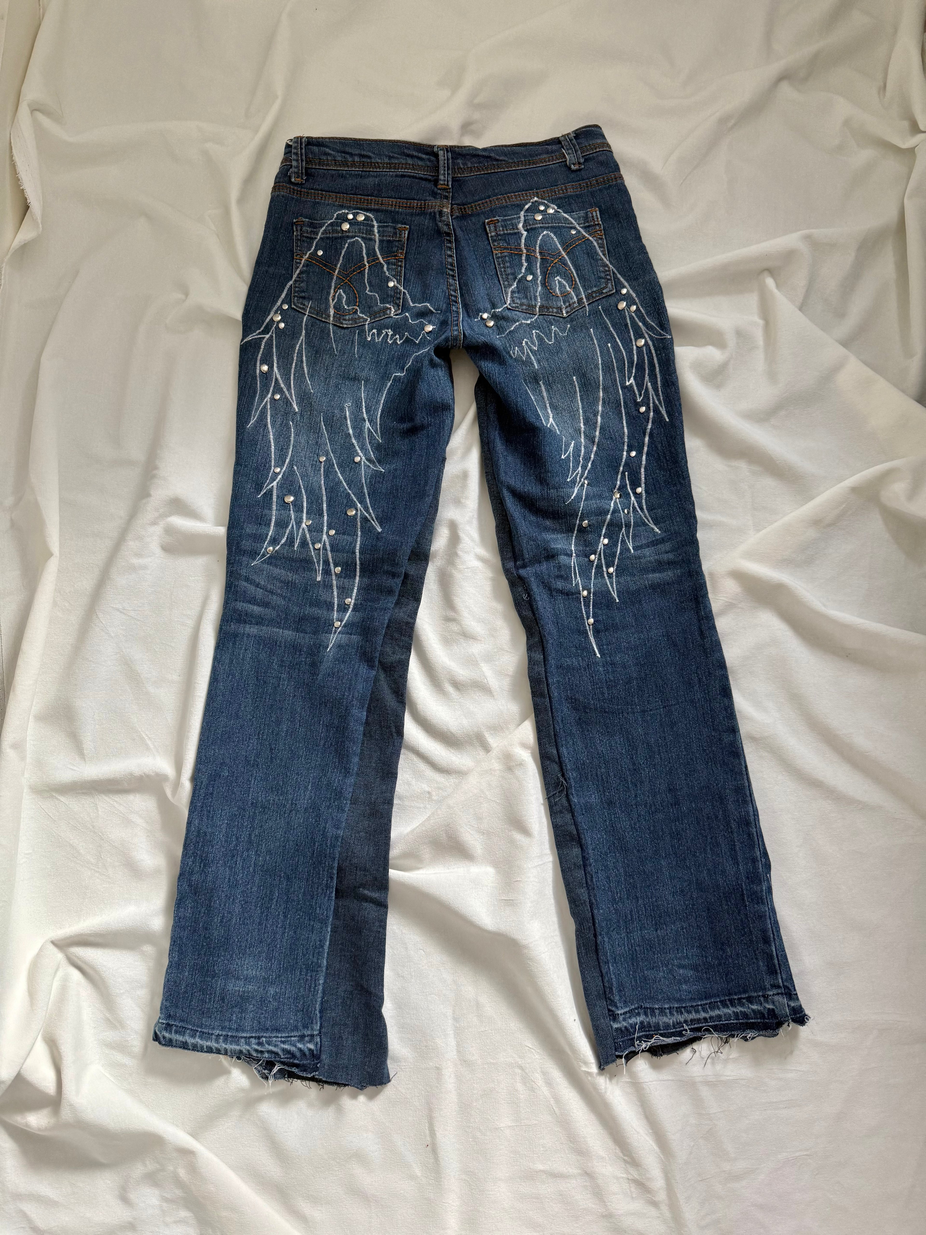 blue denim distressed bootcut jeans